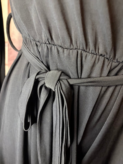 Black long-sleeve off-shoulder mini jumpsuit