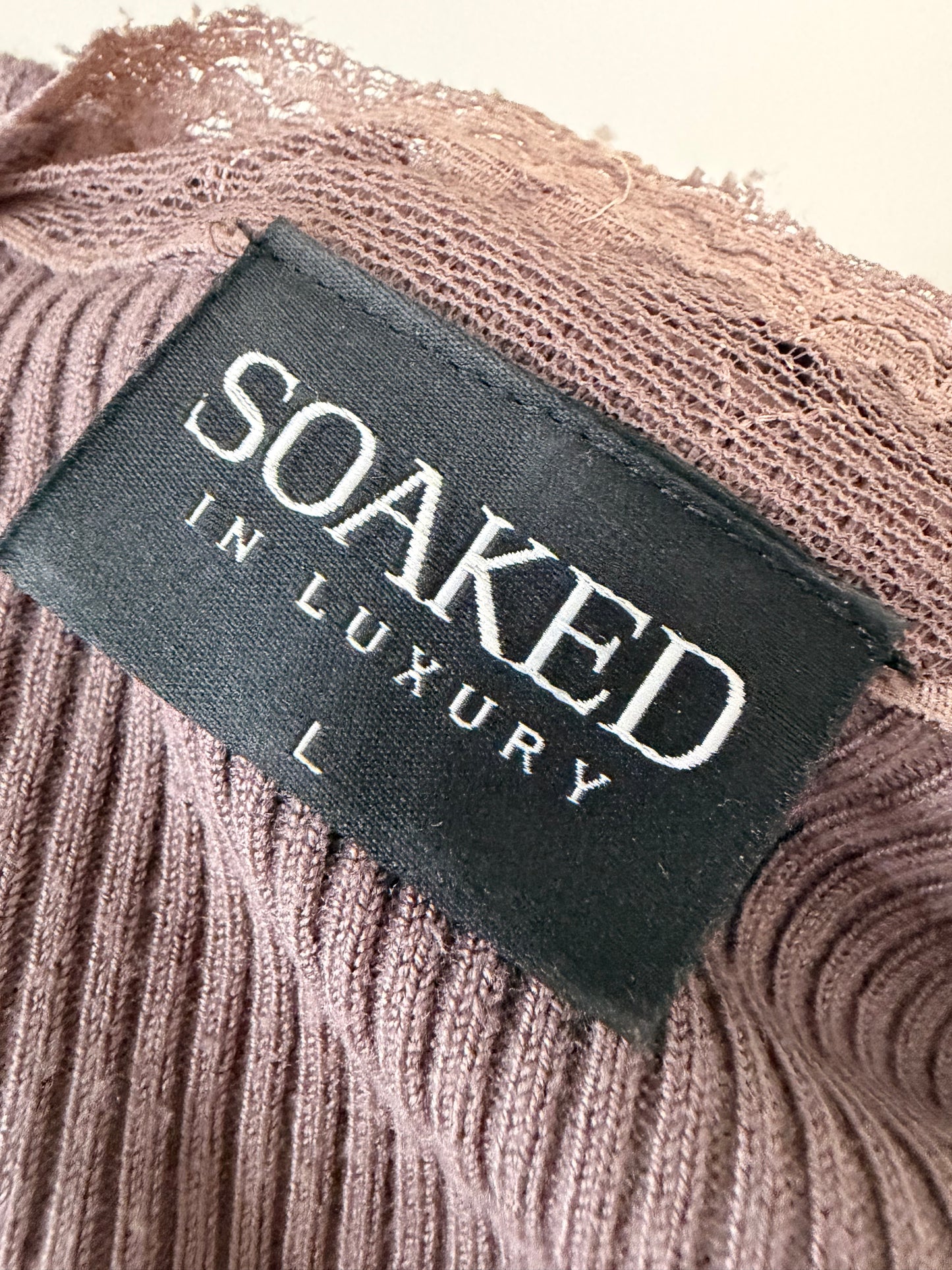 Dark pink knit top with lace details